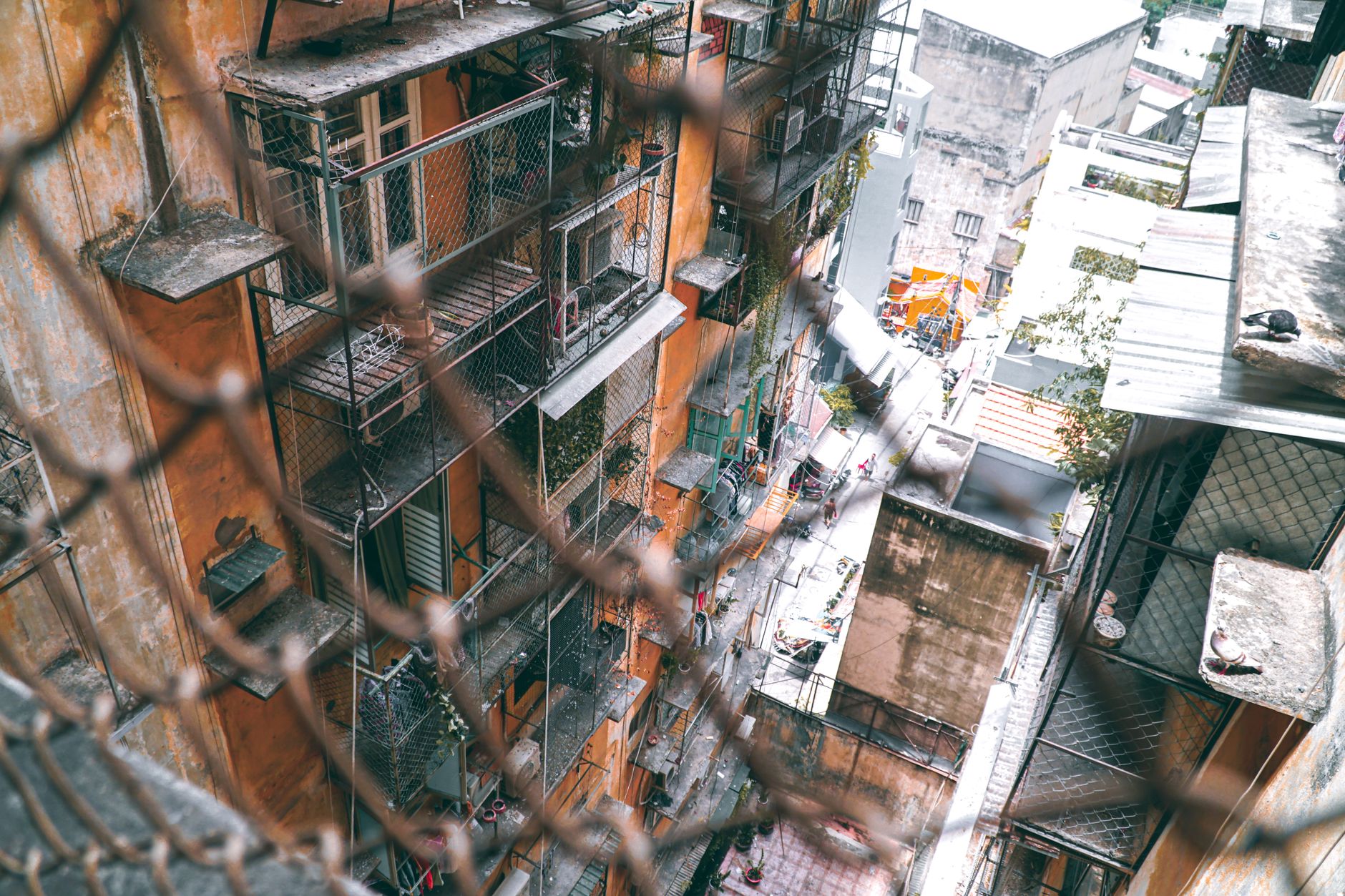 High angle view of an urban residential building with scaffolding and netting.